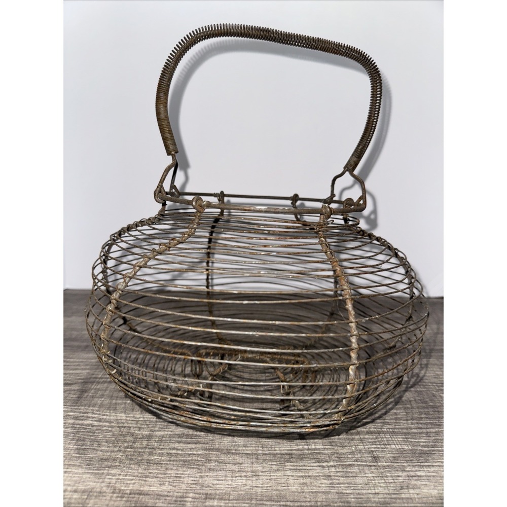 Antique French Wire Egg Basket with coil covered handle and  legs. Farm